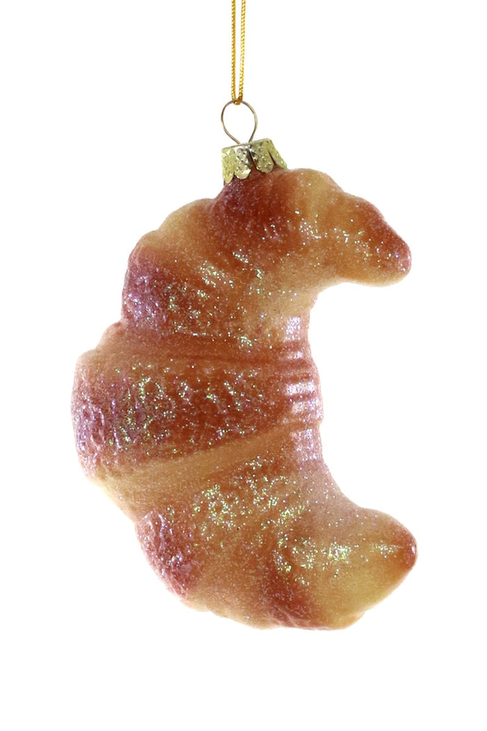 croissant-shaped Christmas ornament on a white background
