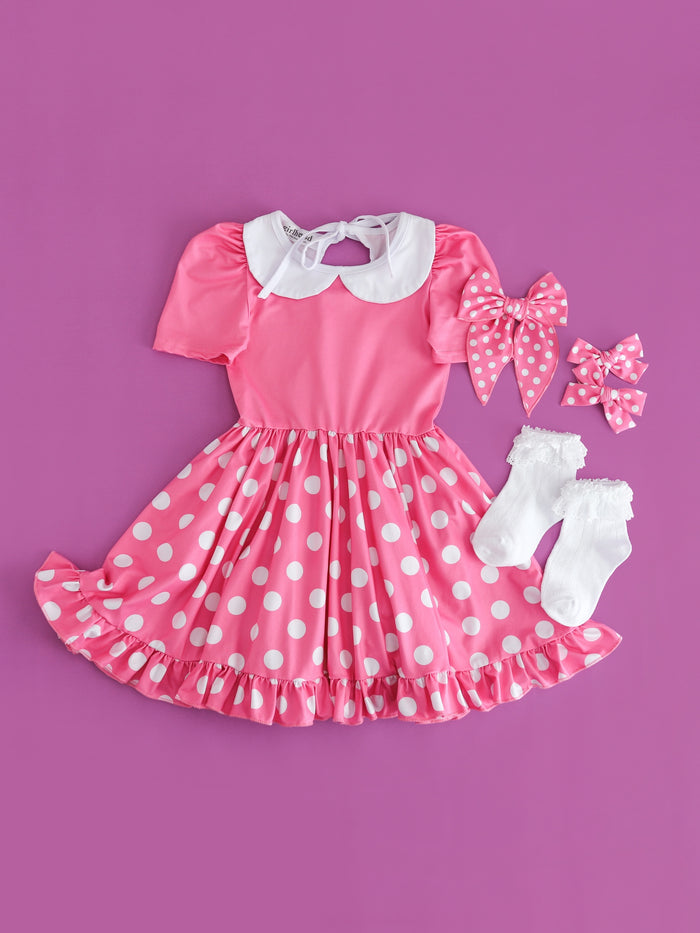 flaylay of girls pink Minnie inspired short sleeve twirl dress with white collar paired with white lace bobby socks and matching pink and white dot hair bows