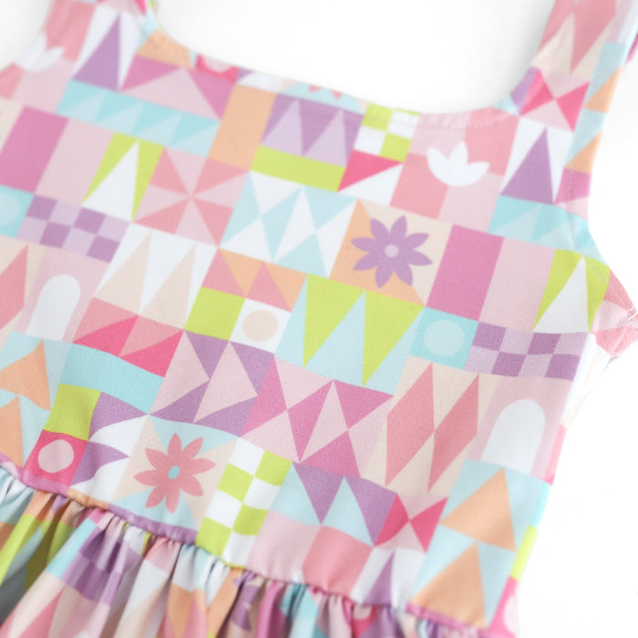 closeup of geometric twirl dress pattern in shades of pink, purple, sky blue and lime green
