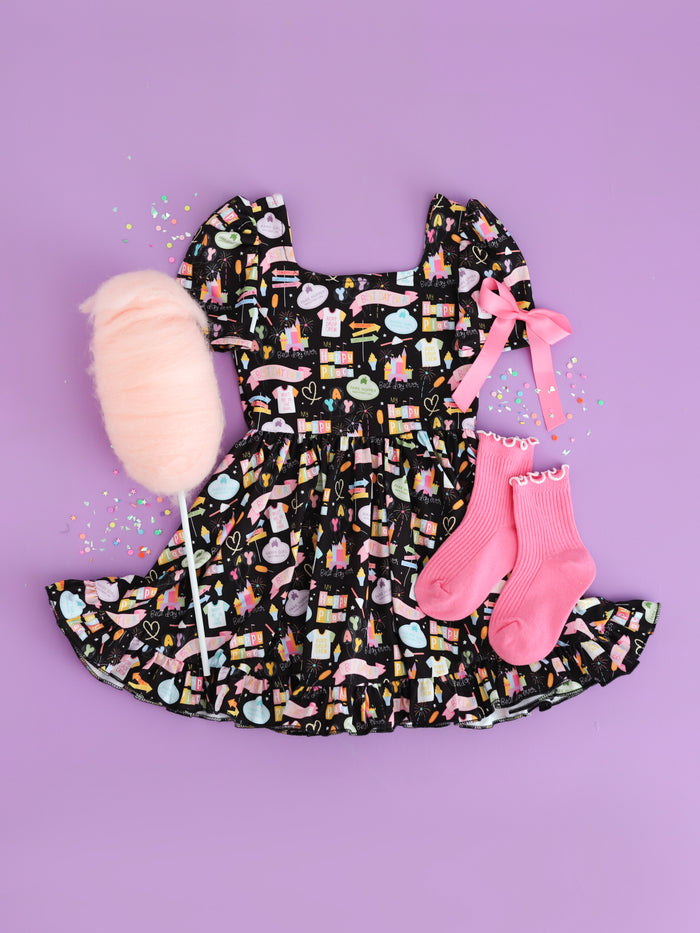 girls' black best day ever short sleeve mod twirl dress styled with pink satin bow and midi socks