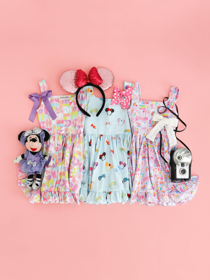 three disney inspired sleeveless print twirl dresses and accessories for a day at the parks