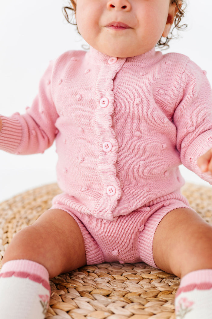 baby wearing quartz pink bubble knit matching set with cardigan and bloomers