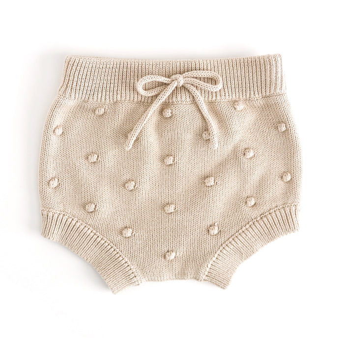 baby girl's cream knit bloomers with faux tie at the waist and 3D bubble texture