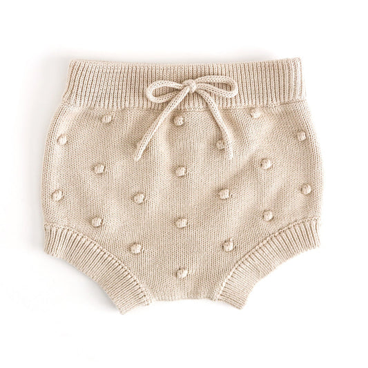 baby girl's cream knit bloomers with faux tie at the waist and 3D bubble texture