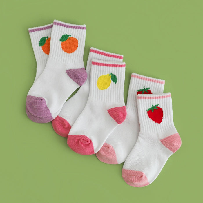 three pairs of girl's summer crew socks with fruity theme: lavender trim with orange design, pink trim with lemon design and light pink trim with strawberry design
