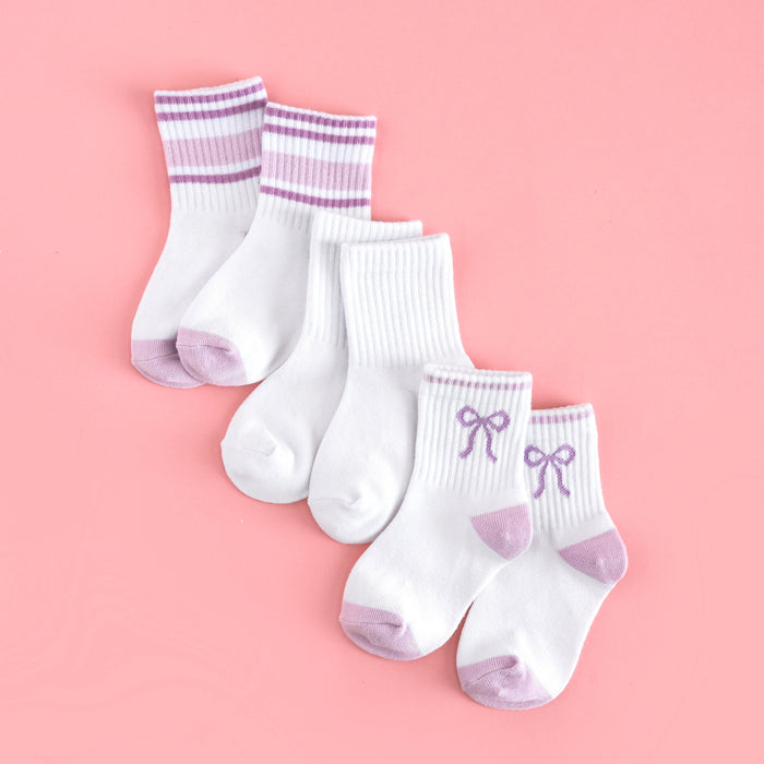 three pack of girl's summer midi crew socks: white with lavender bow design, solid white and white with pastel purple stripes