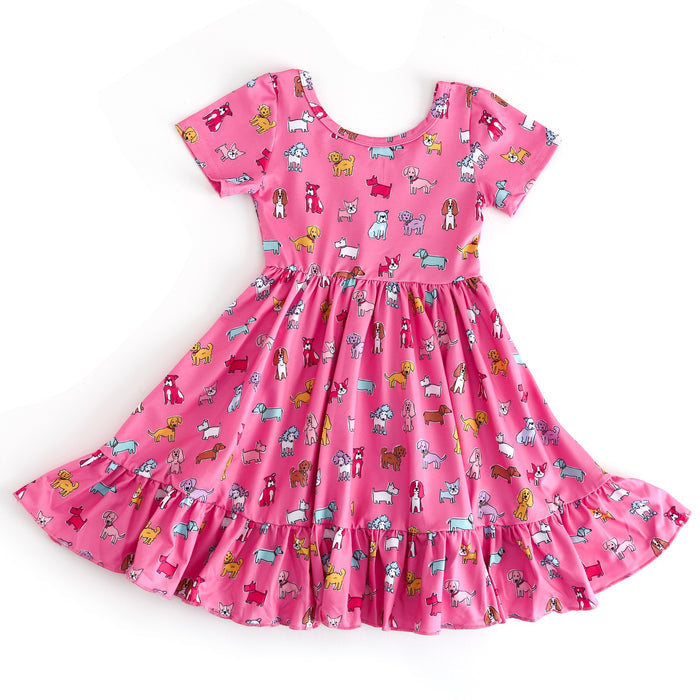 Pink dress with dog pattern on a white background