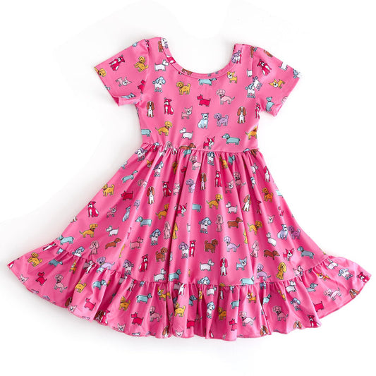 Pink dress with dog pattern on a white background