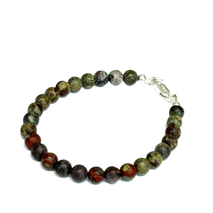 Dragon Blood Jasper gemstone beaded bracelet with sterling silver  lobster claw clasp showing red and green natural patterns  on a white background, left view.