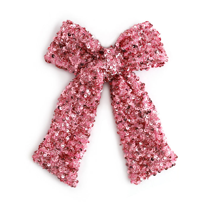 girl's large pink sequin bow on alligator clip