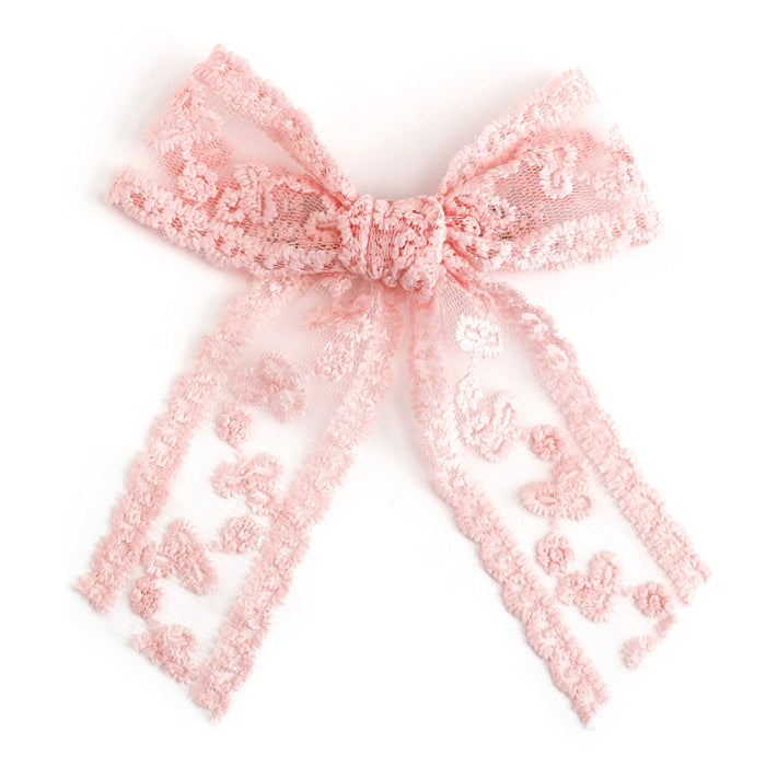 girls' light pink lace bow on alligator clip on clean white background