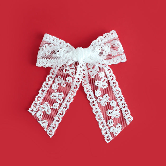 dainty white lace hair bow on silver alligator clip