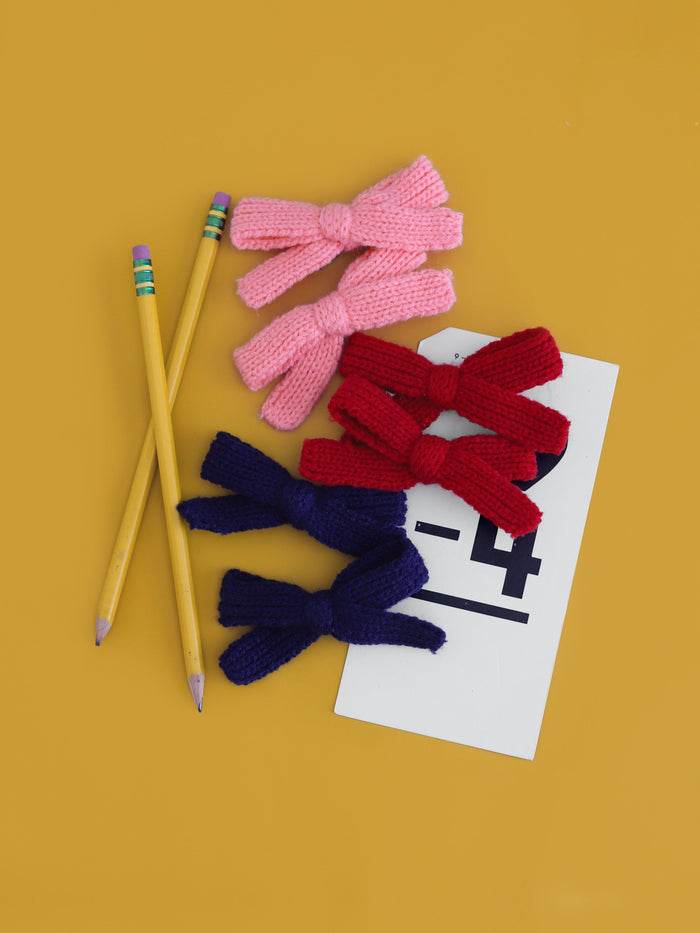 little girl's yarn knit pigtail bows on clips in pink, red and navy to match back to school collection