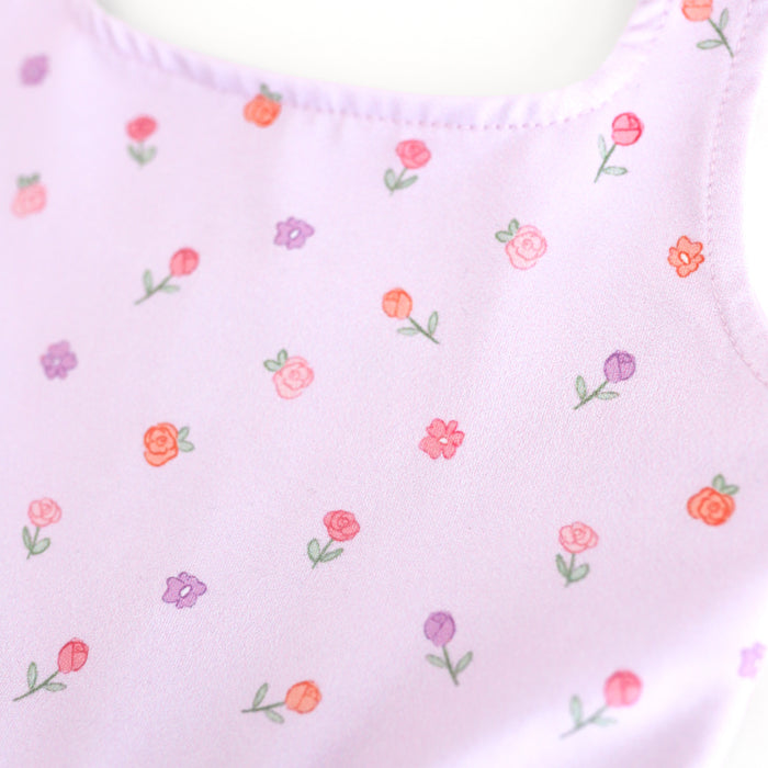 closeup of dainty rosettes in peaches, pinks and purples printed on light lavender twirl dress