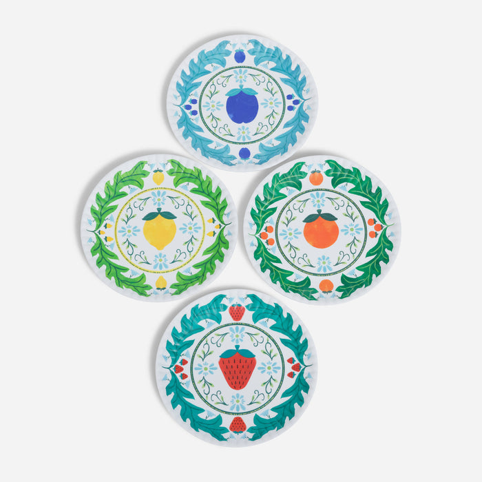 Set of four decorative plates with fruit designs on a white background