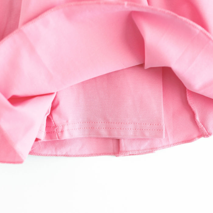 closeup of fitted shorts attached to pink skort