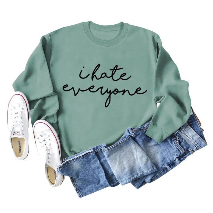 Light green sweater (black font) / S