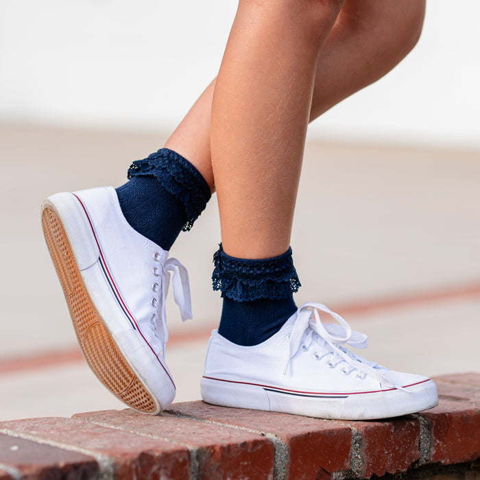 girl in white sneakers paired with navy blue ankle socks with double layer of dainty lace trim for school