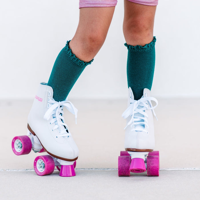 girl in roller skates with lace top knit knee socks in teal