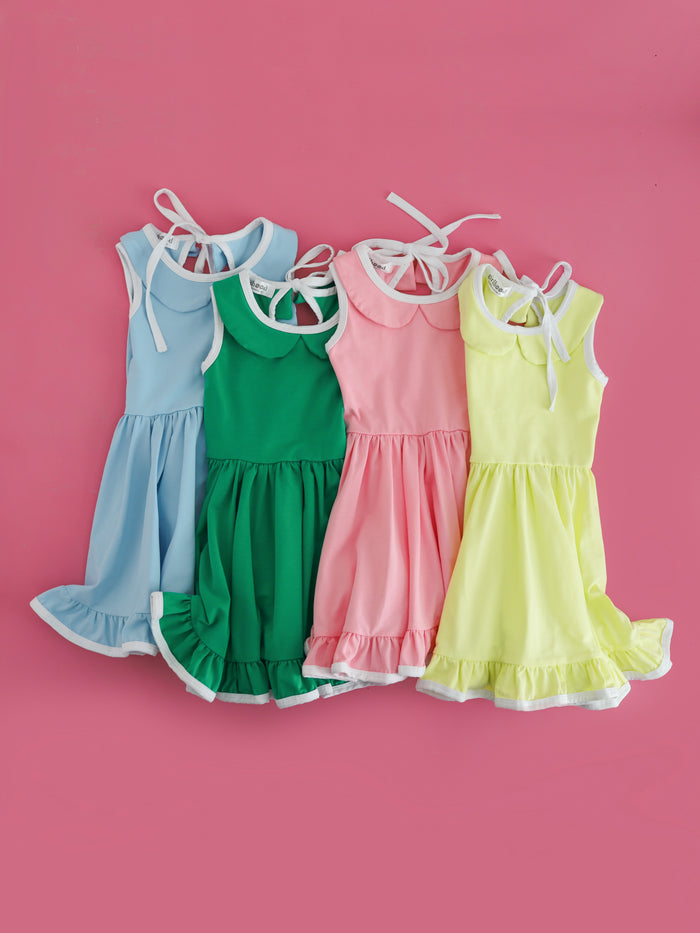 girls solid sleeveless twirl dresses with peter pan collars and white trim in light blue, green, pink and lime green