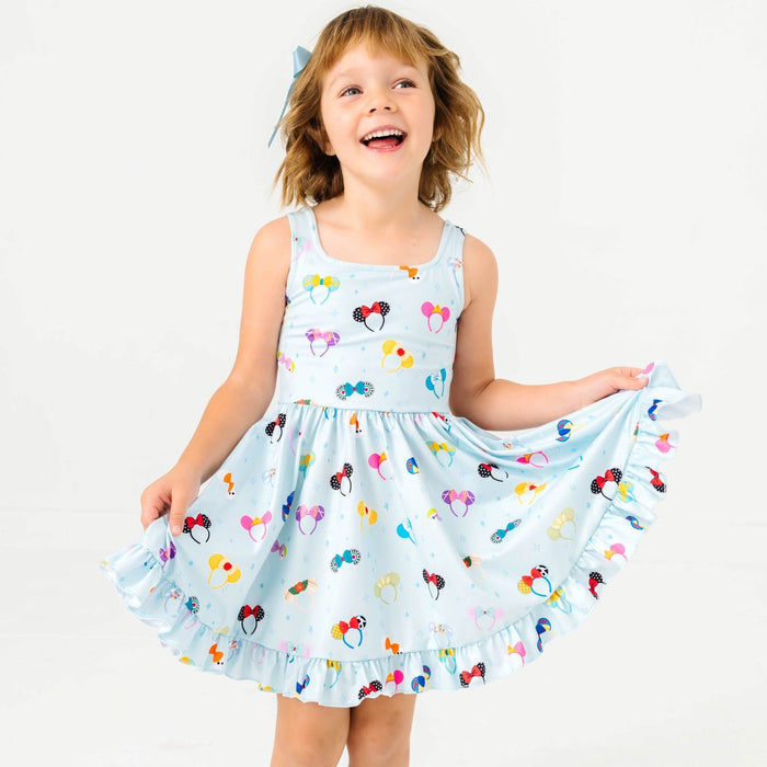 little girl in blue tank dress with magical character inspired ears print