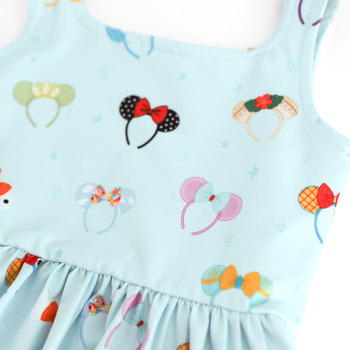 close up of character inspired magical mouse ear print on light blue twirl dress