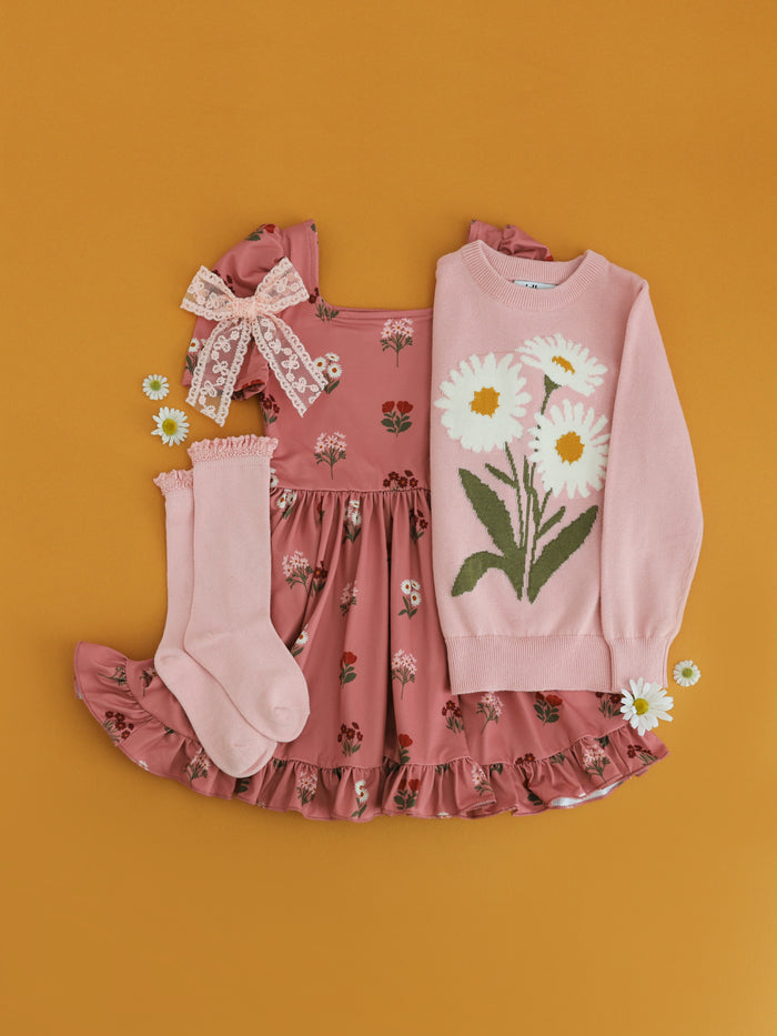 girls' dusty pink fall floral twirl dress paired with light pink sweater with daisy design and matching ivory lace bow and light pink knee socks