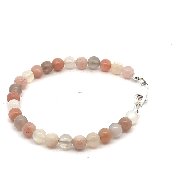 A mix Moonstone gemstone beaded bracelet with a sterling silver lobster claw clasp on a white background, right side, overview.