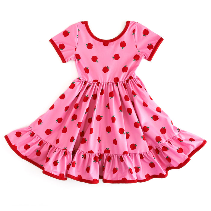 girls' short sleeve, pink scoop neck twirl dress with red trim and red apple print for back to school
