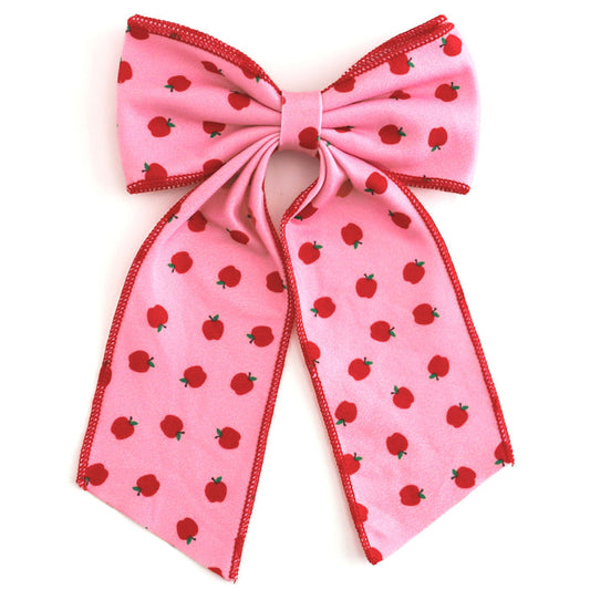 girls' pink oversized double hair bow with red apple print and red trim to match back to school apple print dress