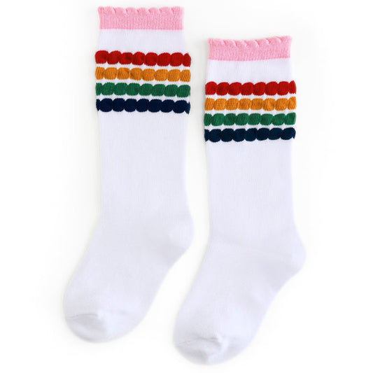 girls white knee socks with primary colored bubble stripe pattern at the calf and pink scalloped trim to match back to school collection