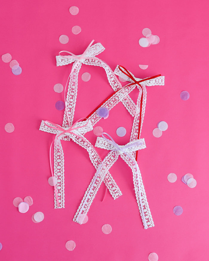 girls long tail white lace hair bows with ribbon bow accents in shades to match valentines collection