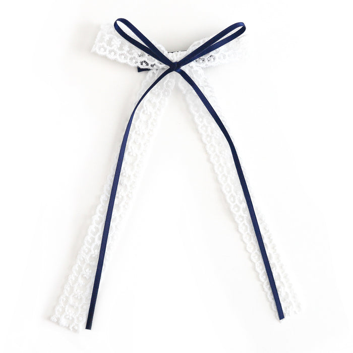 girl's white lace and navy ribbon long tail bow on alligator clip