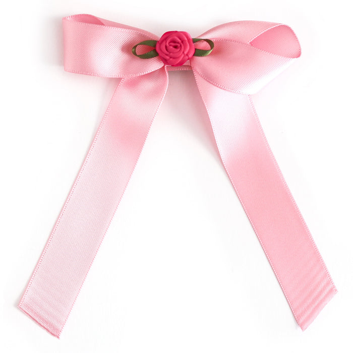 girls' light pink satin ribbon bow on clip with dark pink rosette embellishment in the center