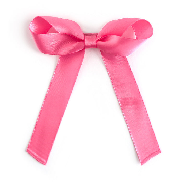 girls taffy pink satin hair bow on alligator clip covered in matching satin
