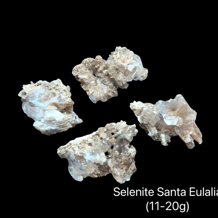Selenite crystal from Santa Eulalia Mexico in translucent white for crown chakra activation angelic connection and spiritual clarity with divine light energy (11-20g), on a black background front view.