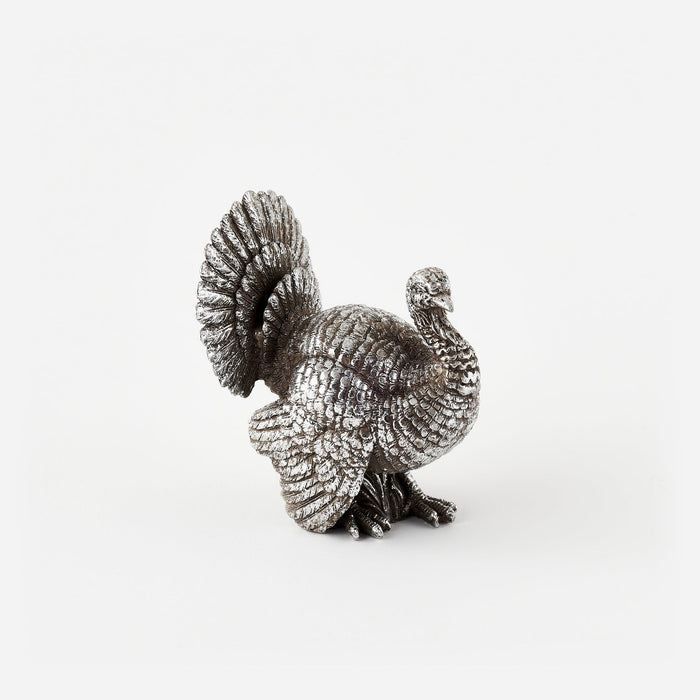 Silver bird figurine on a white background