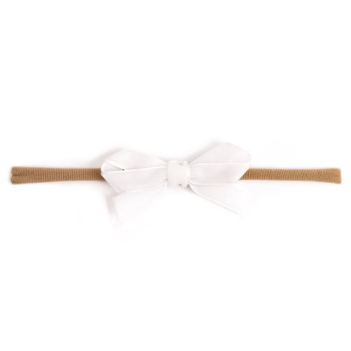baby girl's white velvet ribbon bow on stretchy nylon headband for spring and easter