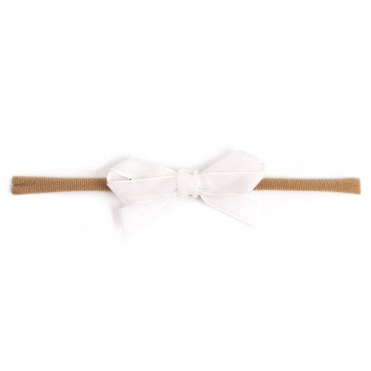 baby girl's white velvet ribbon bow on stretchy nylon headband for spring and easter